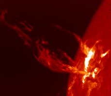 A solar flare with an eruptive prominence (photo by NOAA)